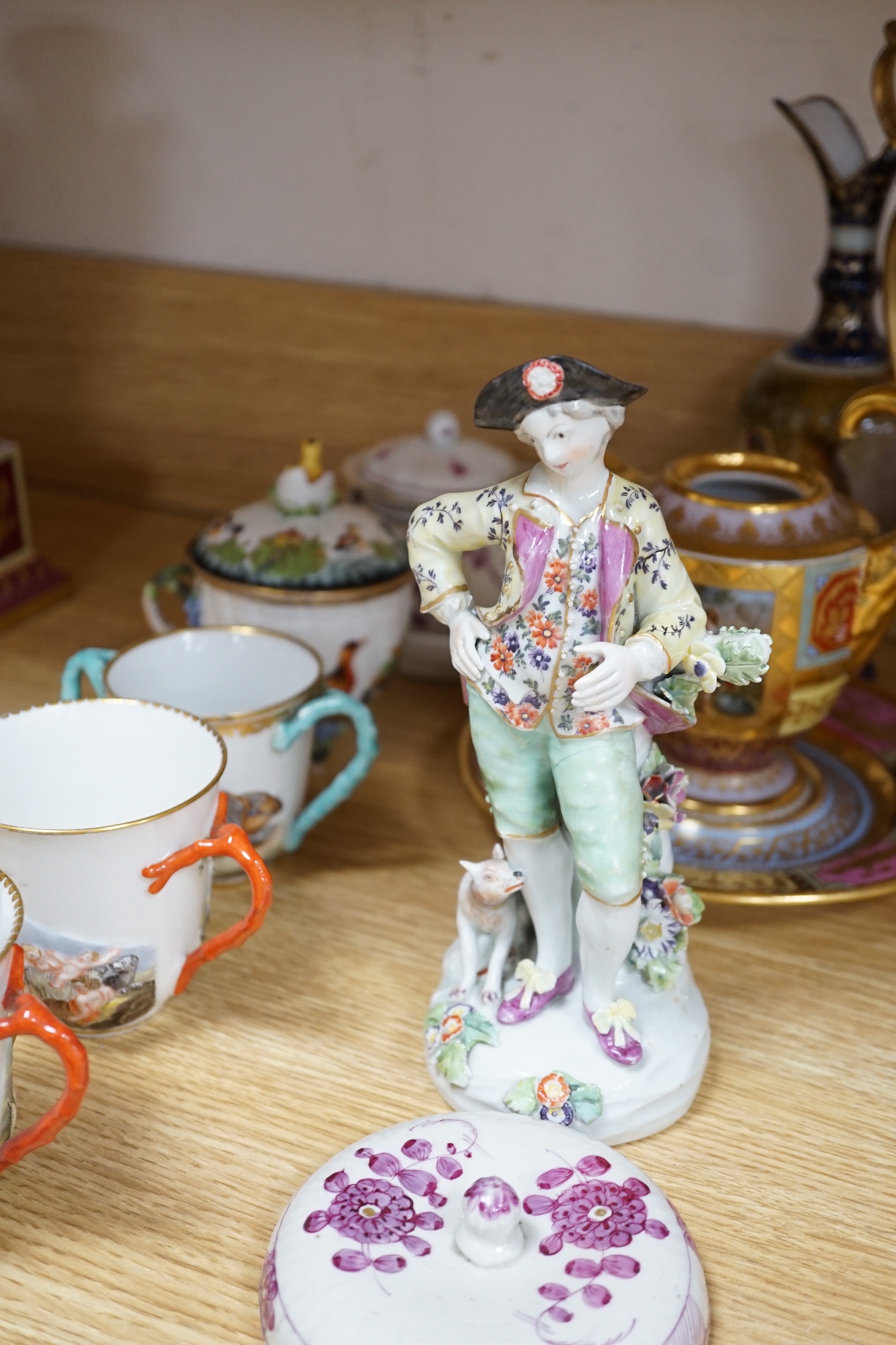19th century Continental tableware, including Richard Ginori Capodimonte style cups and a porcelain figure group of a gentleman and dog, largest 25cm high